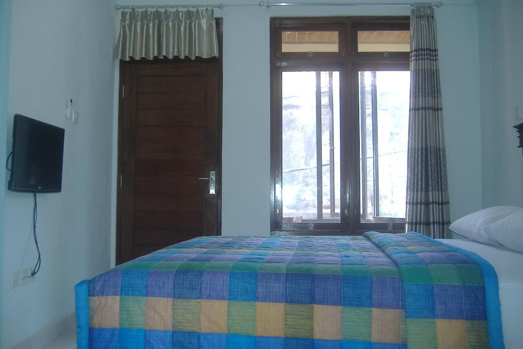 Mustika Inn Kuta Lombok Habitación foto